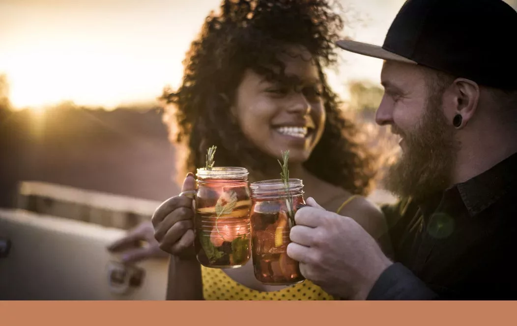 Couple having drinks on roof deck