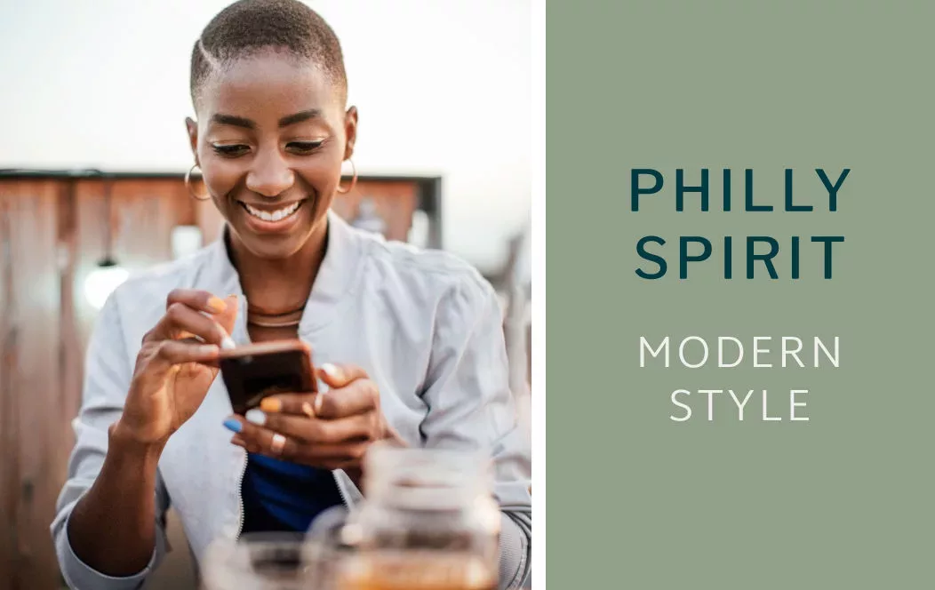 Woman on phone. Text: Philly spirit. Modern style.