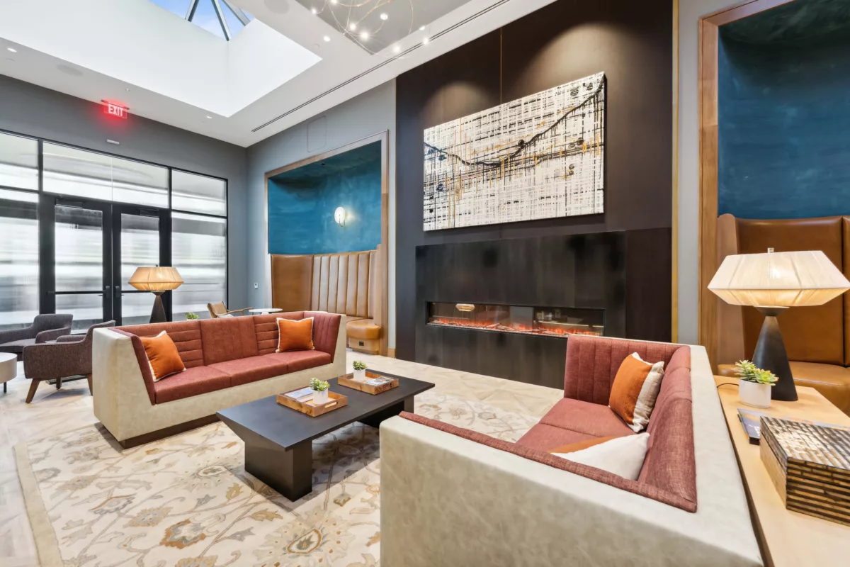 Lobby with fireplace, couches, chairs, and benches
