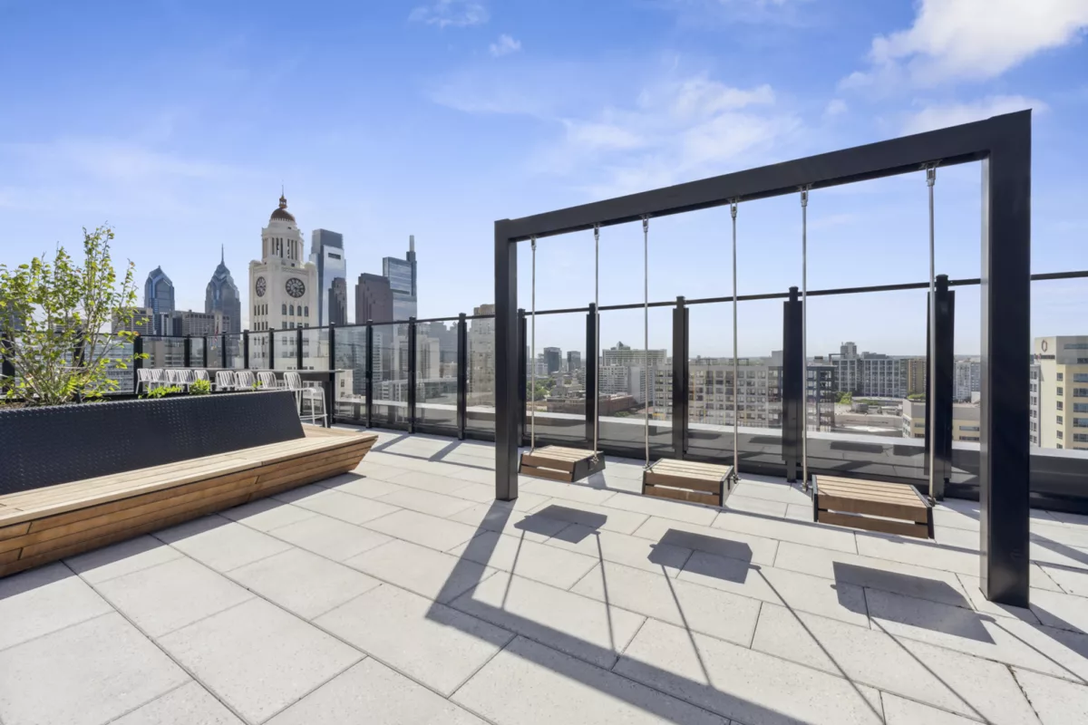 Rooftop deck with swings and city skyline views